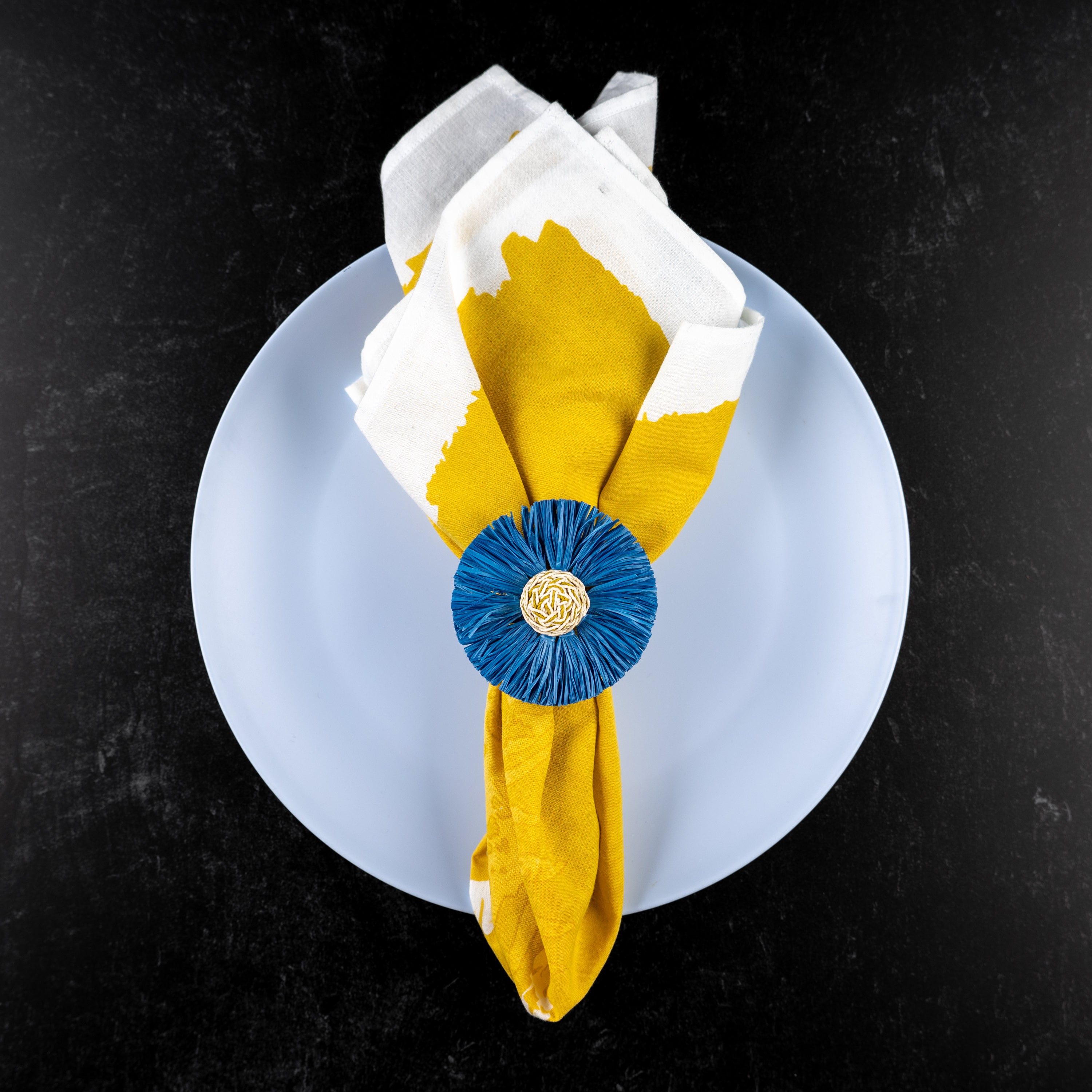 Oil yellow napkin with our blue napkin ring